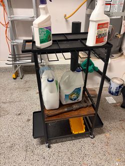 Black metal rolling tool cart