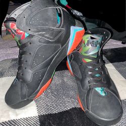 This is a pair of Jordan Air Jordan 7 Retro 30th "Barcelona Nights"