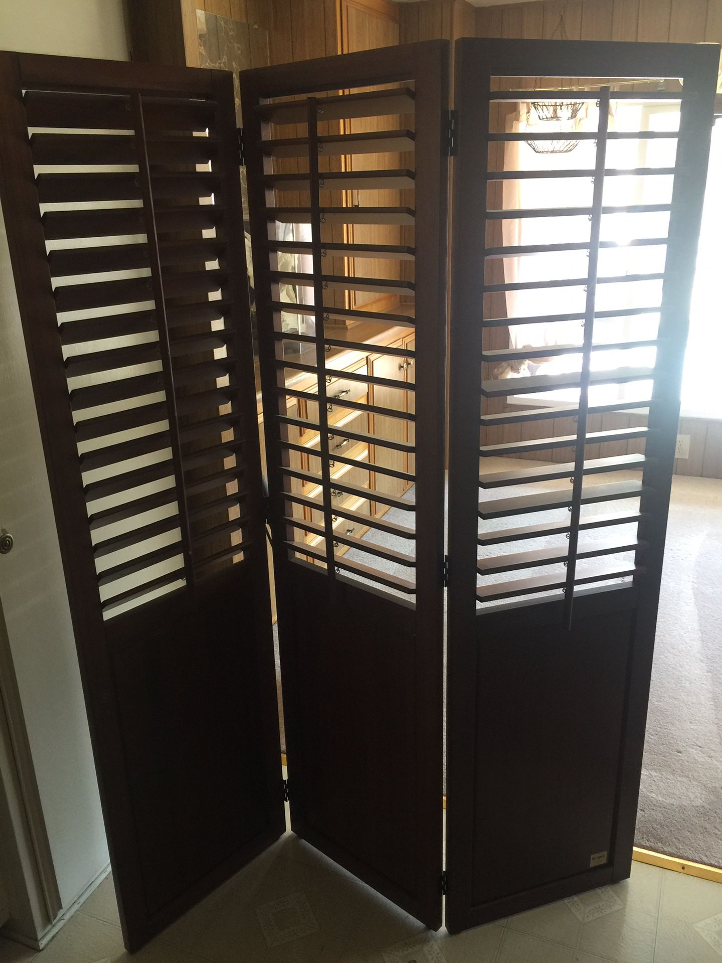 Pier one room divider with opening and closing shutters