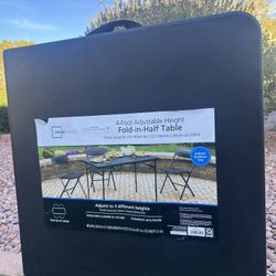 Mainstays 4-Foot Adjustable Height Fold-in-Half Table- brand new, never used. 