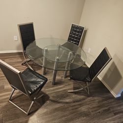 Glass dining table 4 leather chairs 