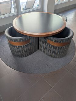 Large Round Table with 4 Nesting Ottomans