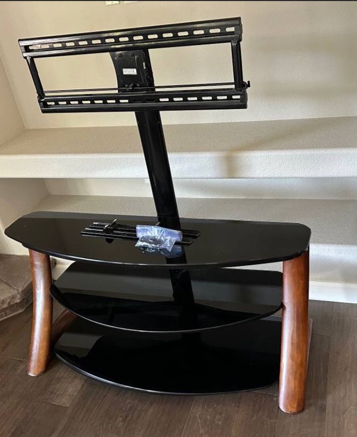 Sturdy wooden and glass TV stand console with built in mount