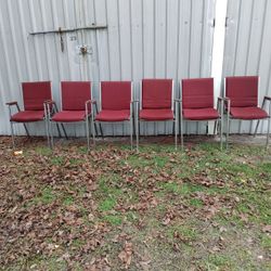 Set Of Red Cushioned Metal Frame Chairs 