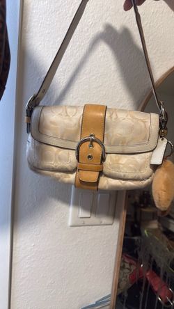 Beige and tan coach flap bag