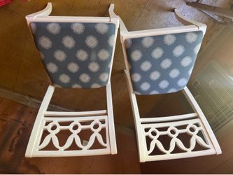 2 wood chairs with blue upholstery