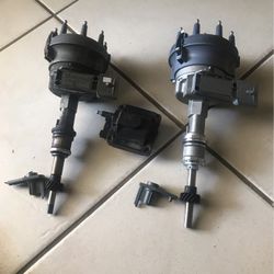 Distributors. Used And New  5.0 On The Left Used-For 5.8 On The Right New Never Been Used And Used Coil Good Condition And Two Rotors Used Good 