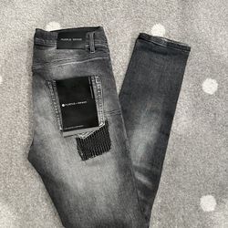 Black tag purple jeans