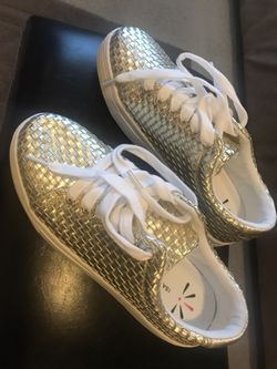 Gold tennis shoes