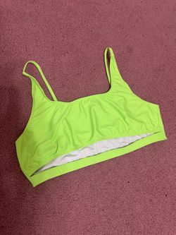 Vibrant neon lime top with a scoop neckline and thin adjustable straps. Designed for everyday swim comfort and light support. Bright neon lime color k