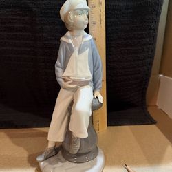 Vintage / Collectible porcelain figurine titled "Boy with Yacht" (Marinerito) by Lladró, specifically model number 4810