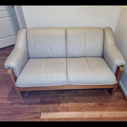 Beige Leather And Wood Loveseat Couch