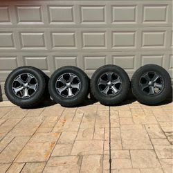 FOUR JEEP RIMS AND BF GOODRICH TIRES
