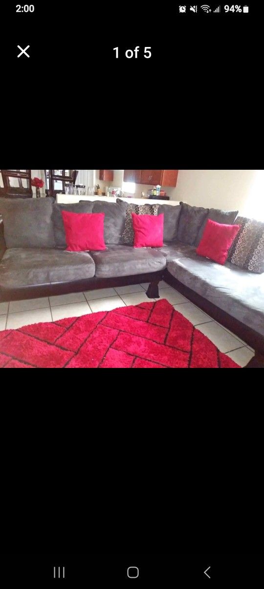 RAF Grey&black Sectional with red decor pillows to match