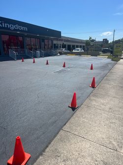 Asphalt sealcoating