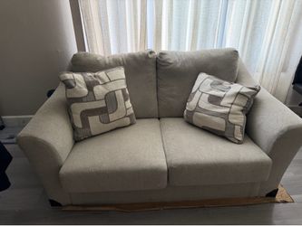 Ashley’s Beige Couch
