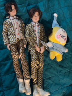 BTS stickers, pins, and dolls