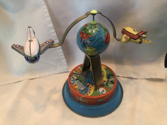Vintage Tin Toy with “flying” planes