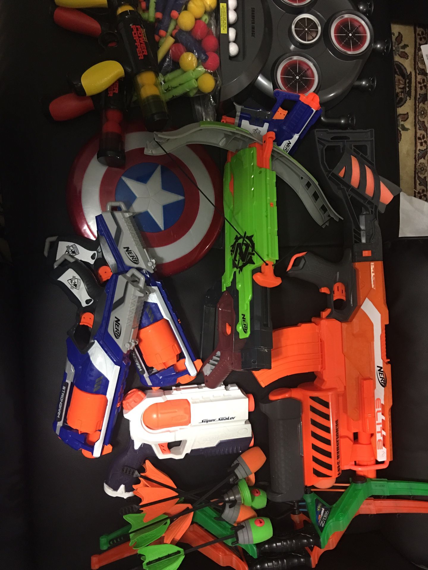 Variety of toy guns and bows. Take everything you see for $20