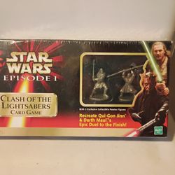 Clash of the Lightsabers" card game, which comes with two exclusive collectible pewter figures.