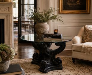 Round glass topped pedestal table