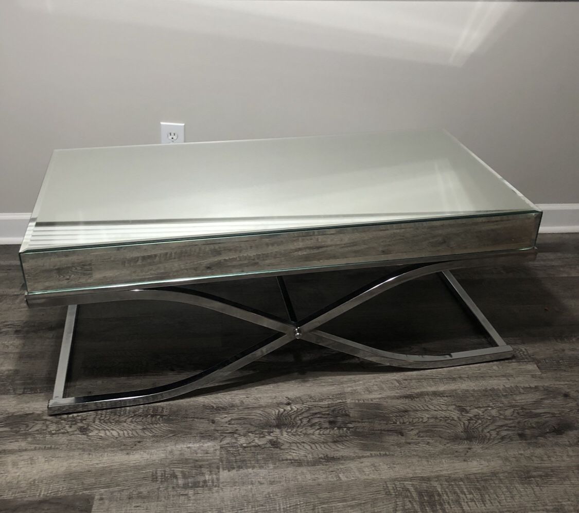 Coffee table with glass top.