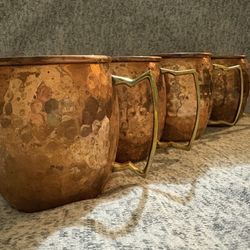 Set of 4 hammered copper Moscow Mule mugs. 