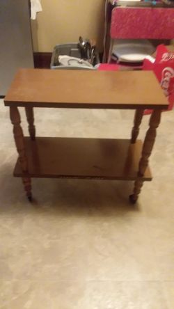 Vintage end table with wheels