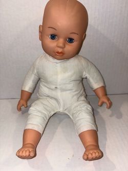 vintage soft-bodied baby doll with blue eyes and a white fabric body. #0046
