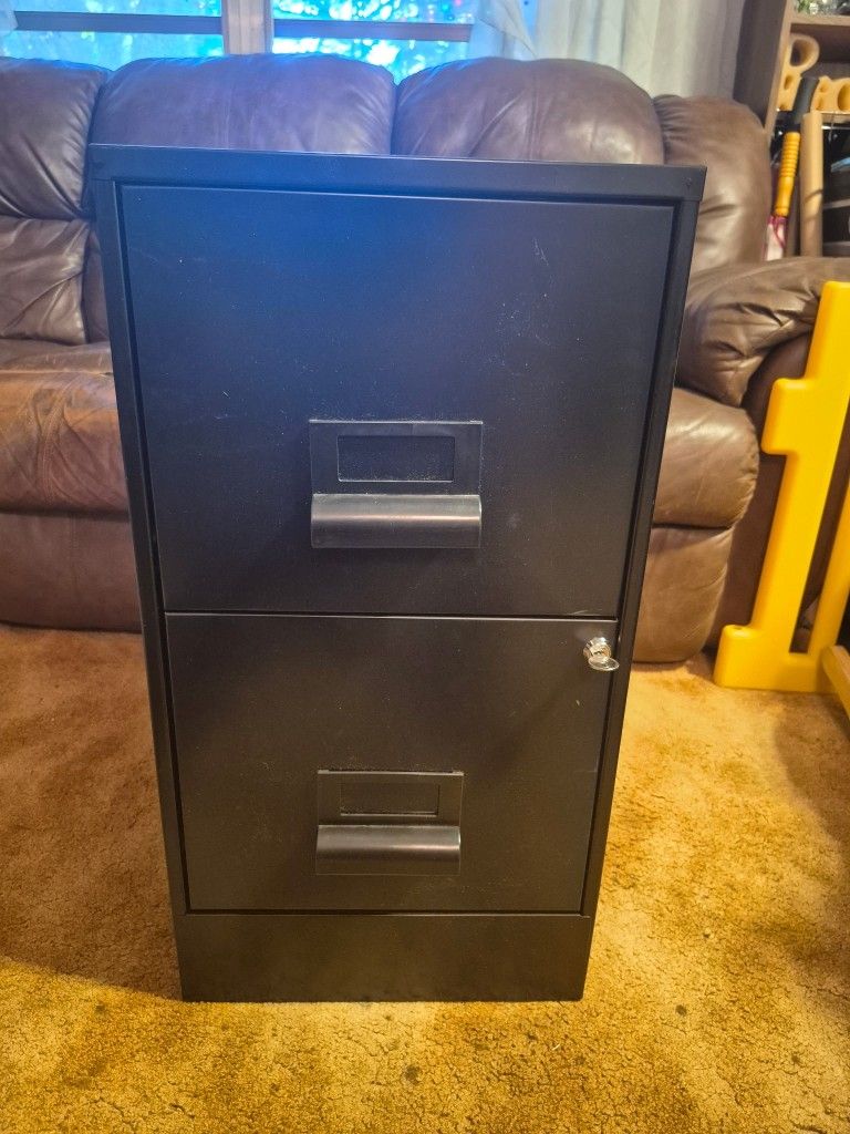 Black 2 drawer file cabinet with locking key and 9 hangers great condition. Exterior paint like new. Height 27. Depth 18. Width 14
