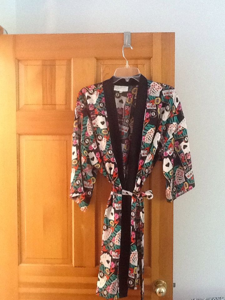 Silky , short women's robe.