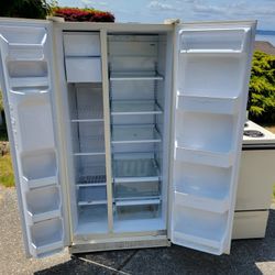 Side By Side Refrigerator And A Range 