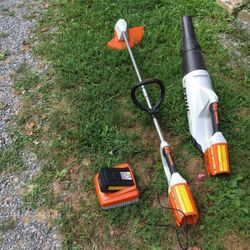 Battery powered string trimmer and blower