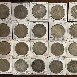 MIXED DATES of silver Morgan’s and Peace dollars. 