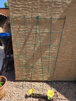 2-metal trellis plastic coated 6ft.tall. $15 for both.