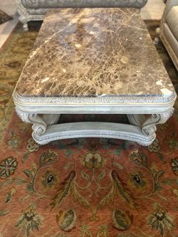 Marble top carved wood coffee table