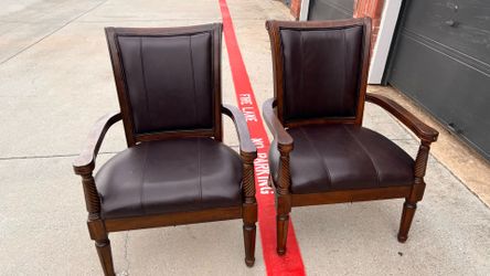 2 solid wood Brentwood Mahogany chairs. Approximately 40 in high and 29 in wide