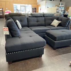 Black Reversible Sectional with Ottoman Accent Pillows