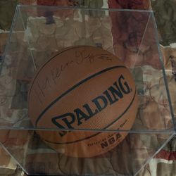 Autographed Hakeem Olajuwon  brown Spaulding basketball