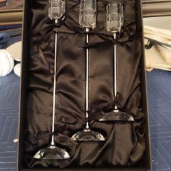 Three tapered Shannon crystal candle sticks