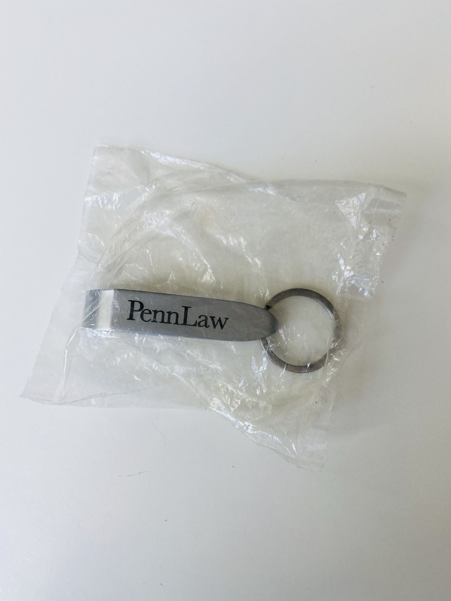 Key Chain-Bottle Opener. University of Pennsylvania Law School logo.Attach it to your keys and you will be always ready to have a sip of beer or water