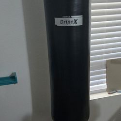 Standing Punching Bag With MMA Gloves.