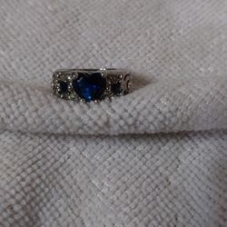 Sterling Silver Ring With White Sapphire Stones And A Blue Sapphire Heart