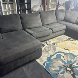 Dark grayish blackish Couch good condition clean we sell all the time delivery extra party local