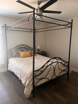 Queen canopy bed.
