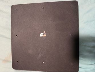 PS4 with remote and power cord with games