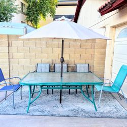 Large Green Glass Table With umbrella And Chairs
