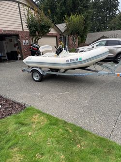 1997 zodiac hard bottom inflatable  11 ft