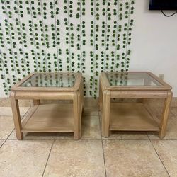 Two wooden glass top side tables