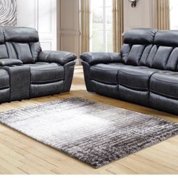 New Graphite Reclinable Sofa And Loveseat 